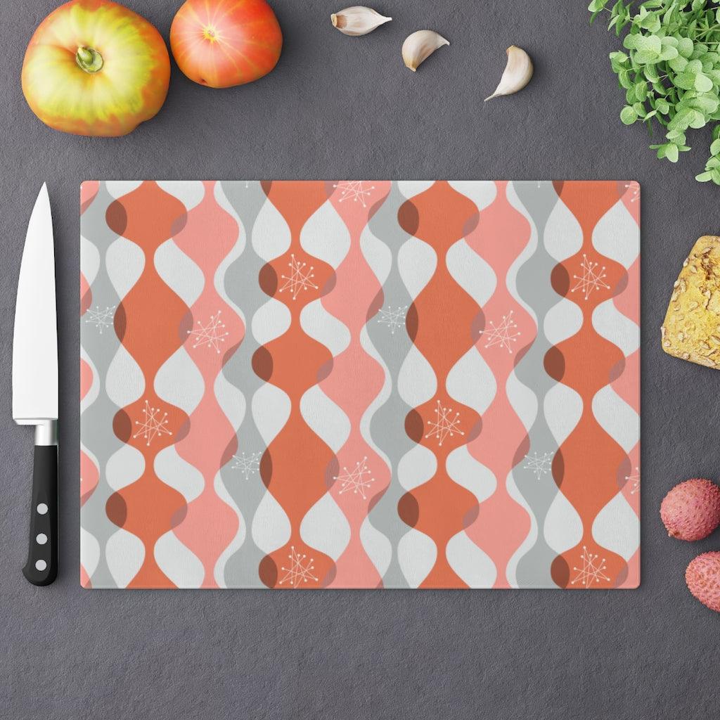 Mid Century Mod Atomic Bursts & Waves Pink Glass Cutting Board | lovevisionkarma.com