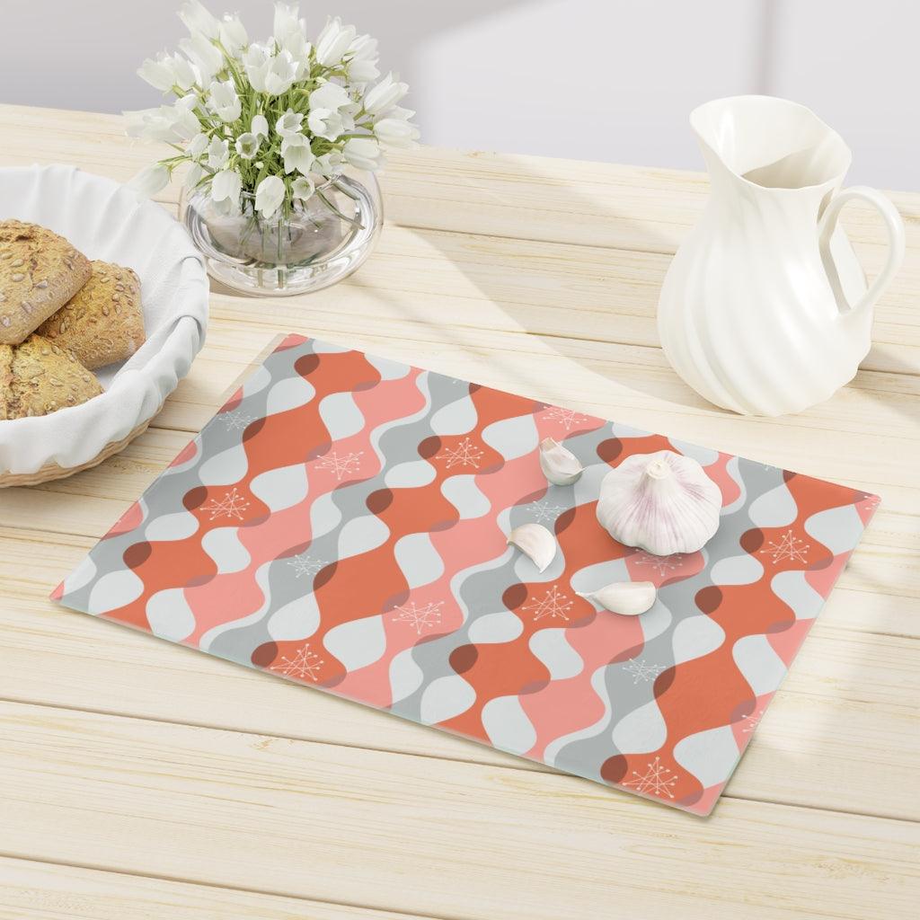 Mid Century Mod Atomic Bursts & Waves Pink Glass Cutting Board | lovevisionkarma.com