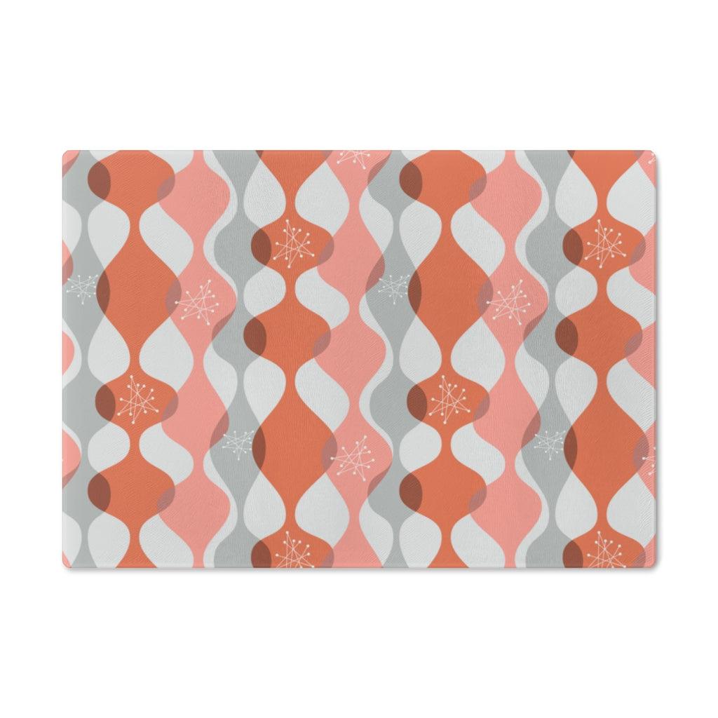 Mid Century Mod Atomic Bursts & Waves Pink Glass Cutting Board | lovevisionkarma.com