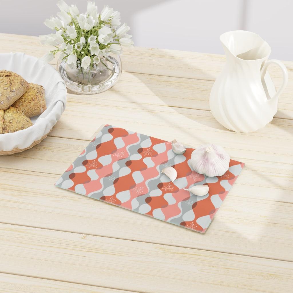 Mid Century Mod Atomic Bursts & Waves Pink Glass Cutting Board | lovevisionkarma.com