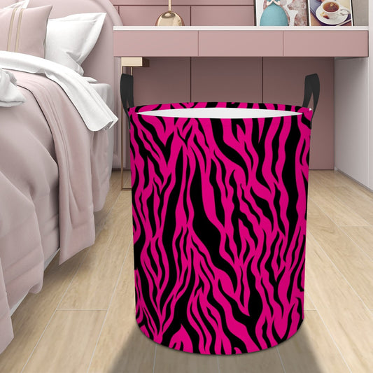 Pink and black tiger stripe animal print patterned laundry basket in a bedroom.